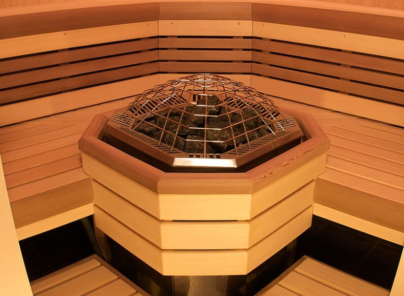 Close up image of a heater inside of a traditional sauna